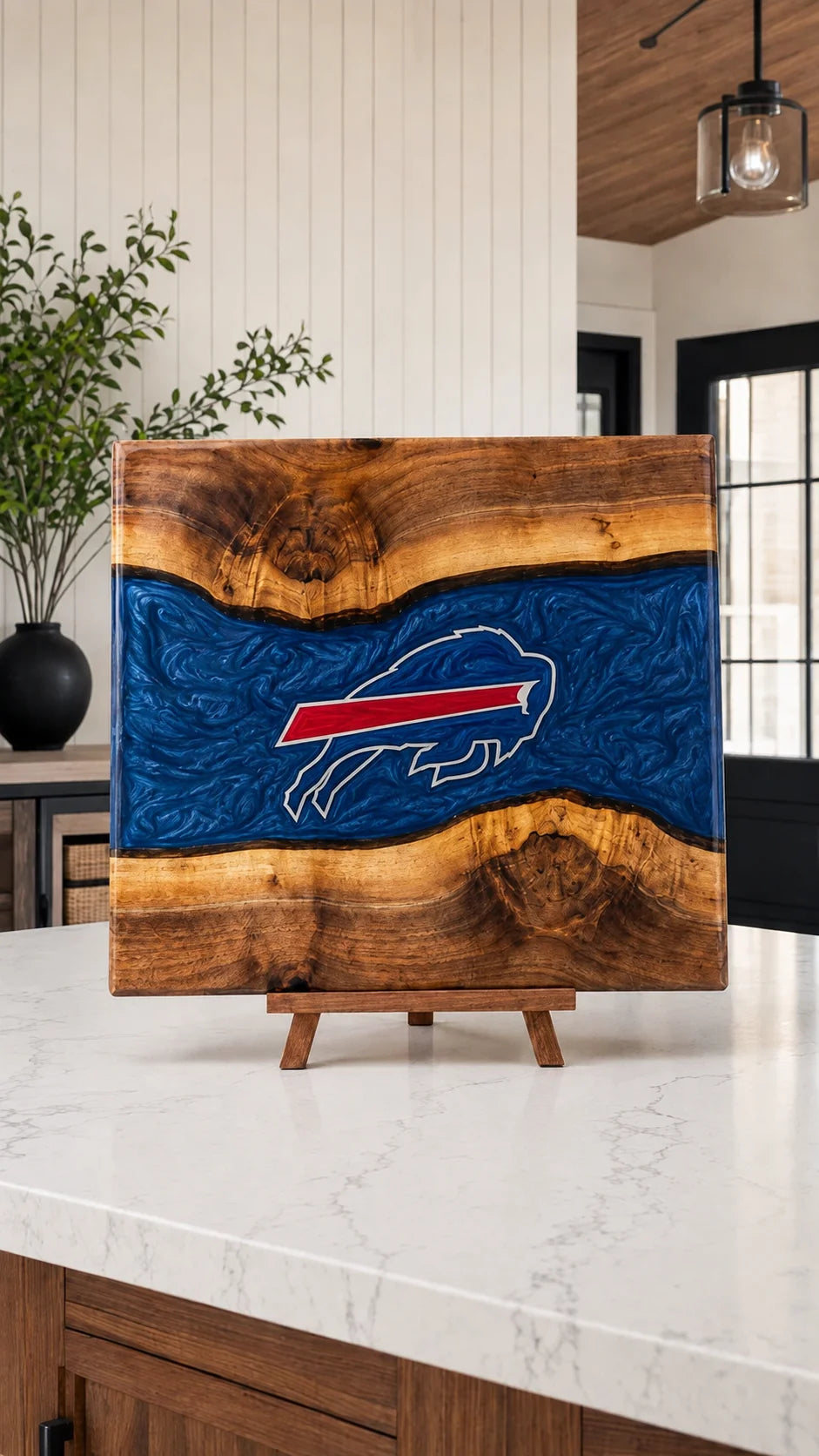 Walnut board with blue resin river and engraved buffalo crest
